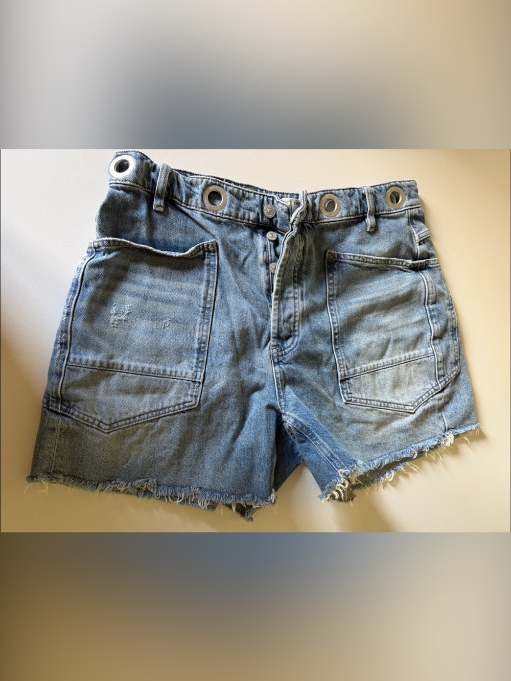 We The Free Distressed Light Blue Denim Shorts with Grommet Waist